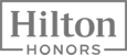 The image shows the "Hilton Honors" logo in gray lettering within a rectangular frame.